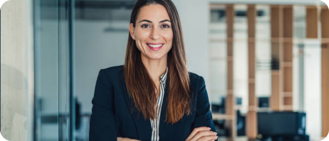 A woman with long hair and a jacket on.